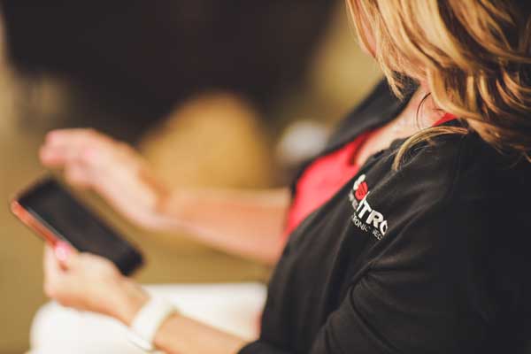 Woman using an access management app on her phone