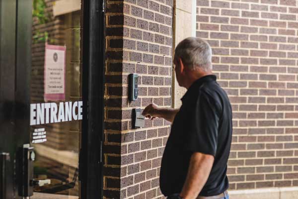 enterpriseaccess_2 Man entering a building using an electric access control
